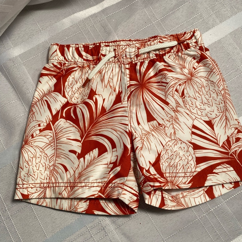 Old Navy Baby Boys Swim Shorts in a rust tropical print. Size 6-12 months.